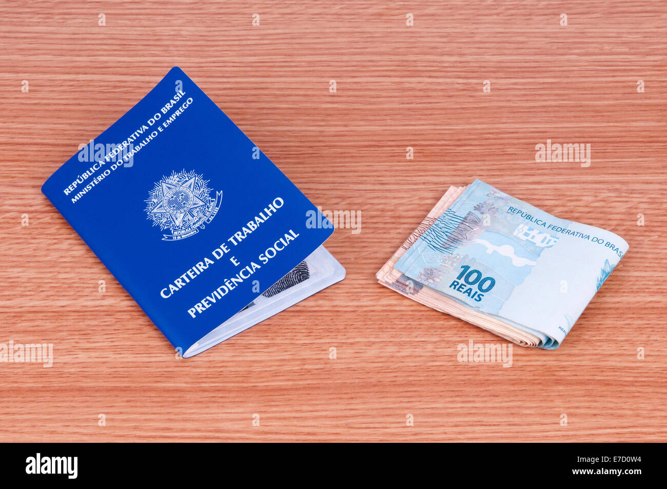 Brazilian work document and social security document (carteira de trabalho) and brazilian currency (Real) Stock Photo