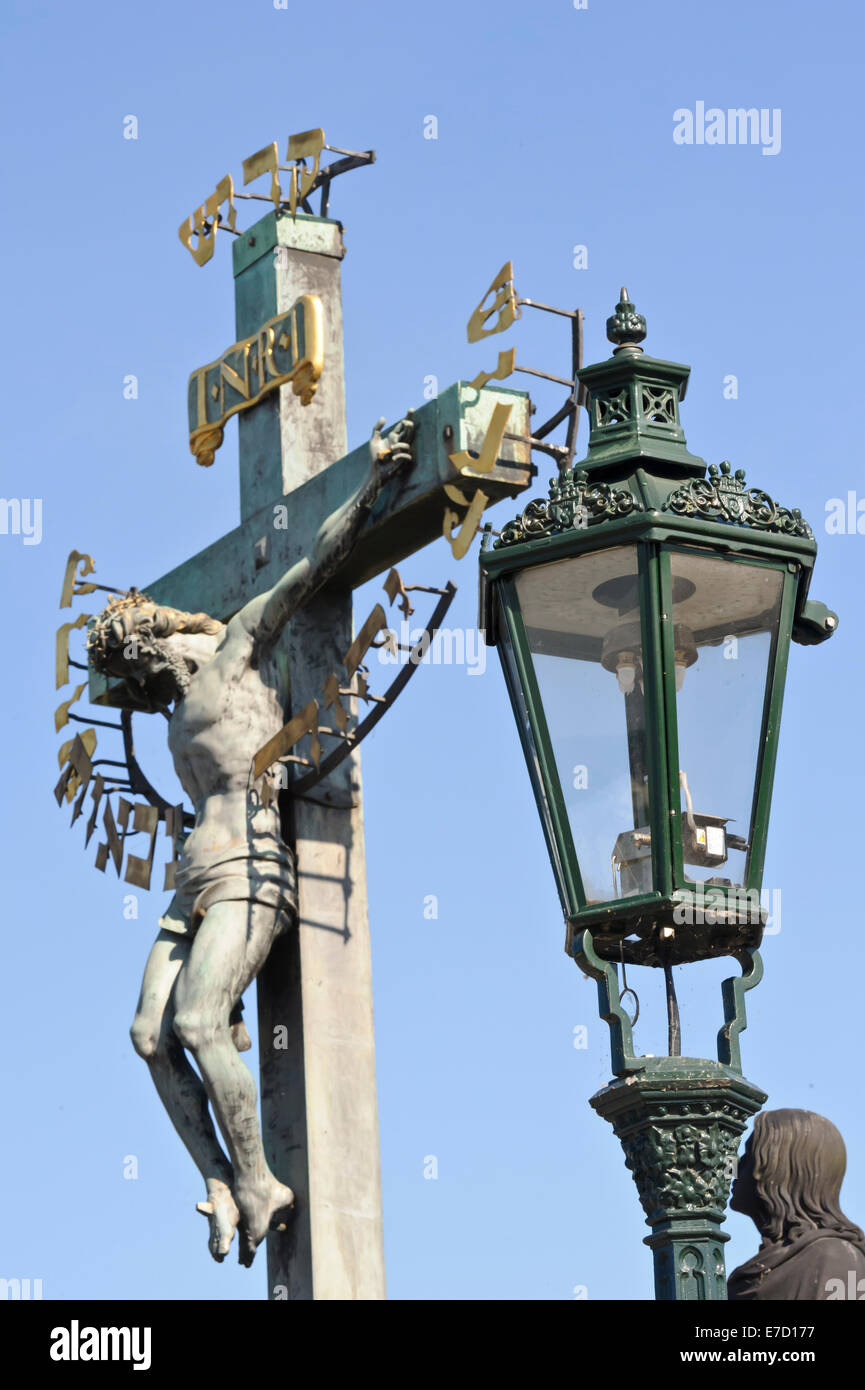 Statue of Jesus on the cross against a deep blue sky on the Charles ...