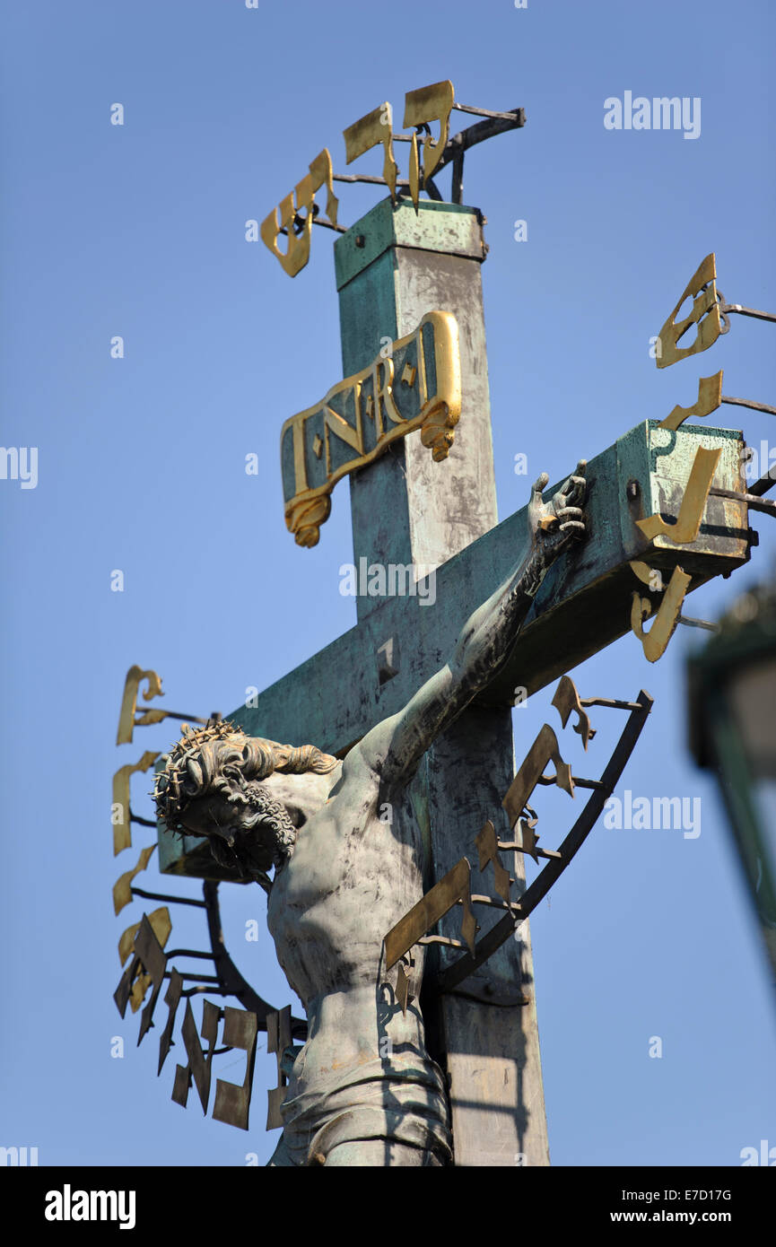 Statue of Jesus on the cross against a deep blue sky on the Charles ...