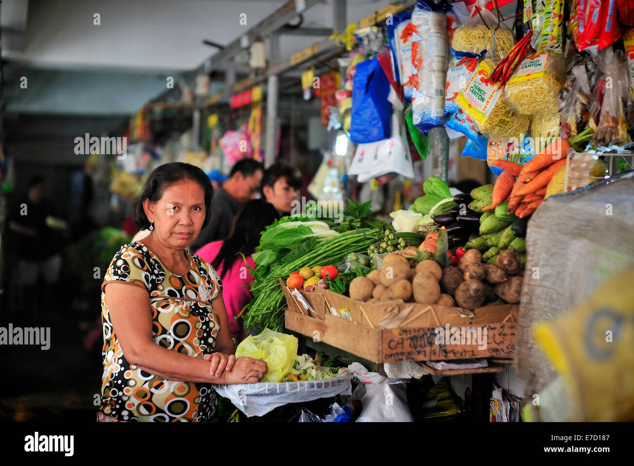 Filipina managing fresh food stall in Lahug Market Cebu City Philippines Stock Photo