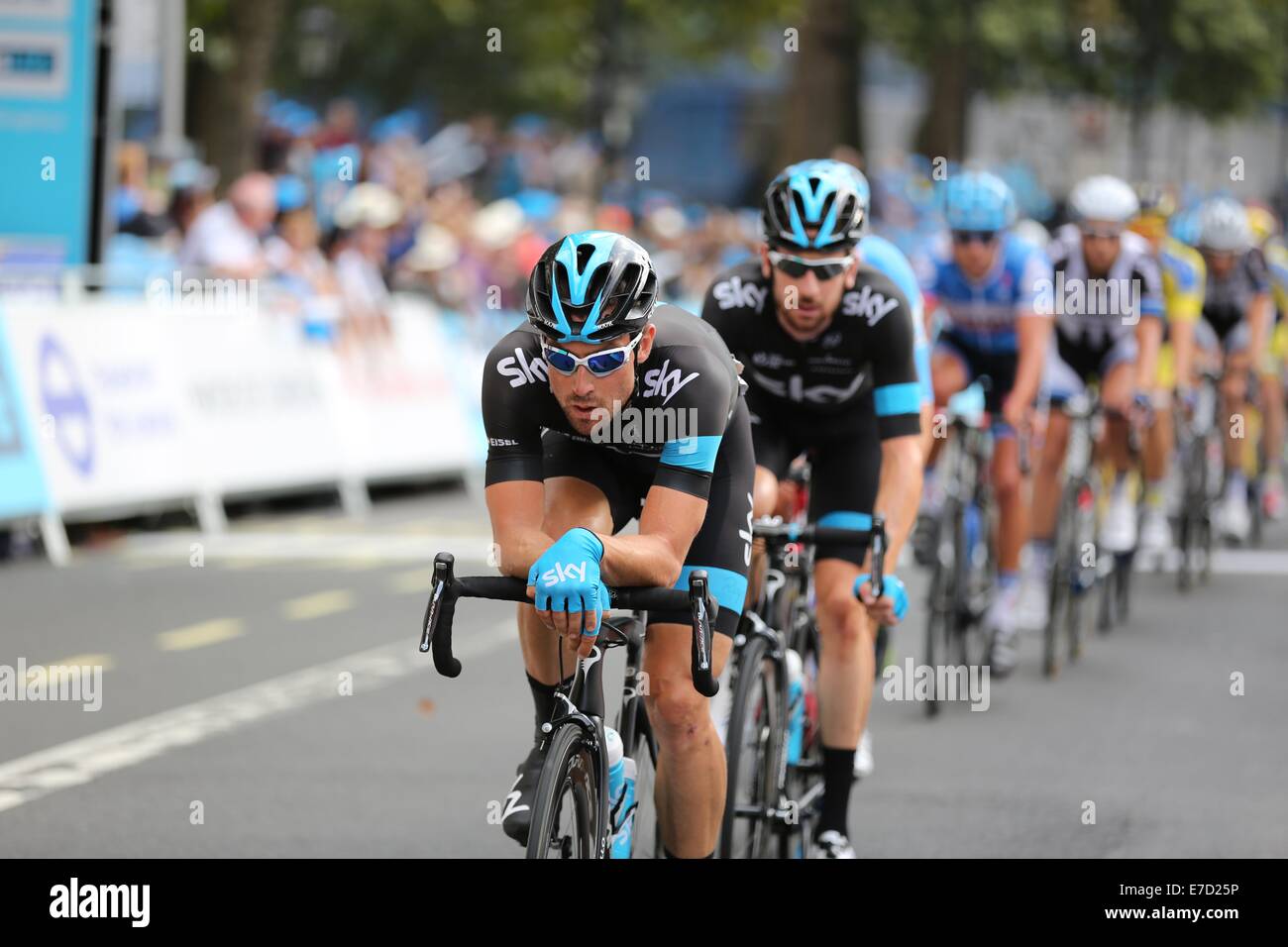 London. 14th September 2014. 2014 Tour of Britain, Stage 8b. London. Circuit Race. Bernie Eisel of Team Sky leads the Sir Bradley Wiggins and the peloton over the line after the second of ten laps Credit:  Neville Styles/Alamy Live News Stock Photo