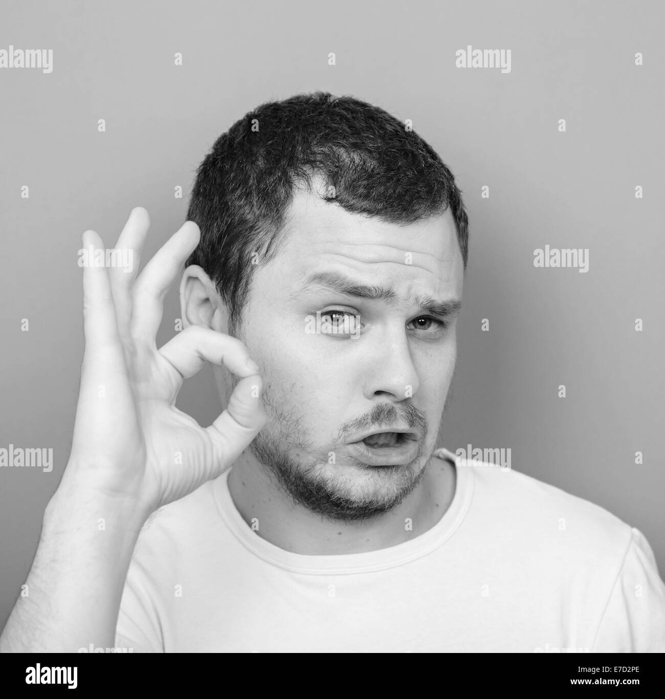 Portrait of funny man showing OK gesture - Monocrome or black and white portrait Stock Photo