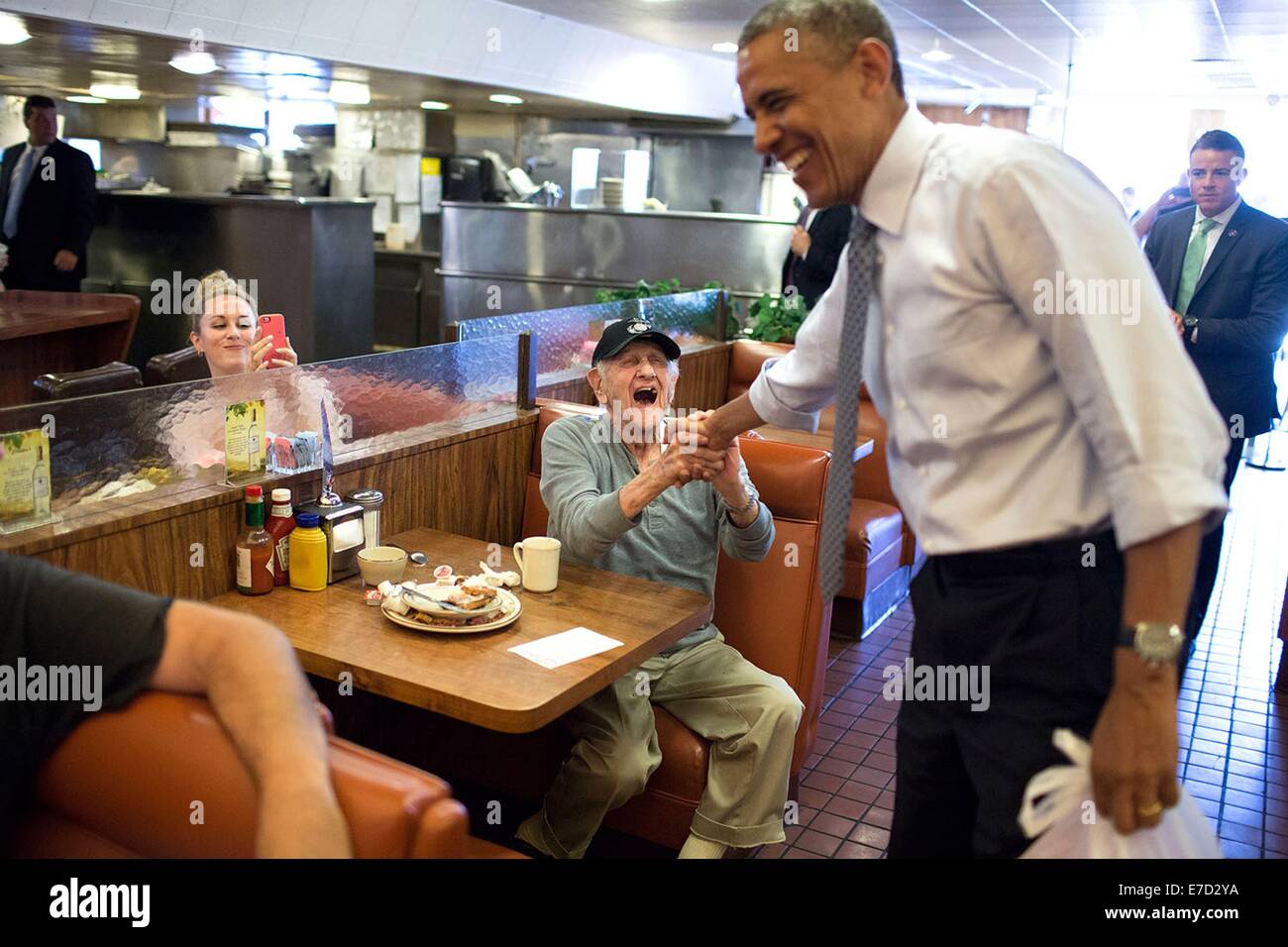 US President Barack Obama greets patrons at Canter's Delicatessen July 24, 2014 in Los Angeles, California. Stock Photo