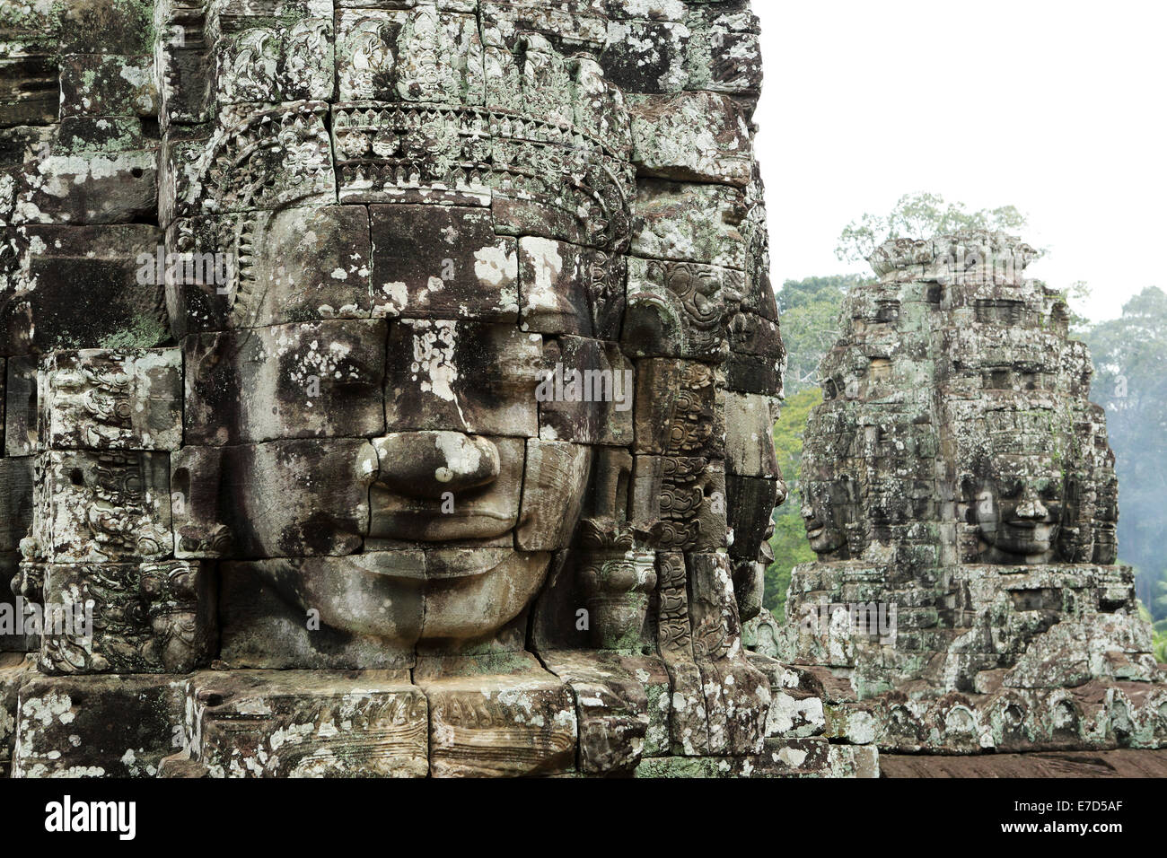 Sculpted stone heads at the Bayon temple, part of Angkor Wat in Siem Reap, Cambodia. Stock Photo