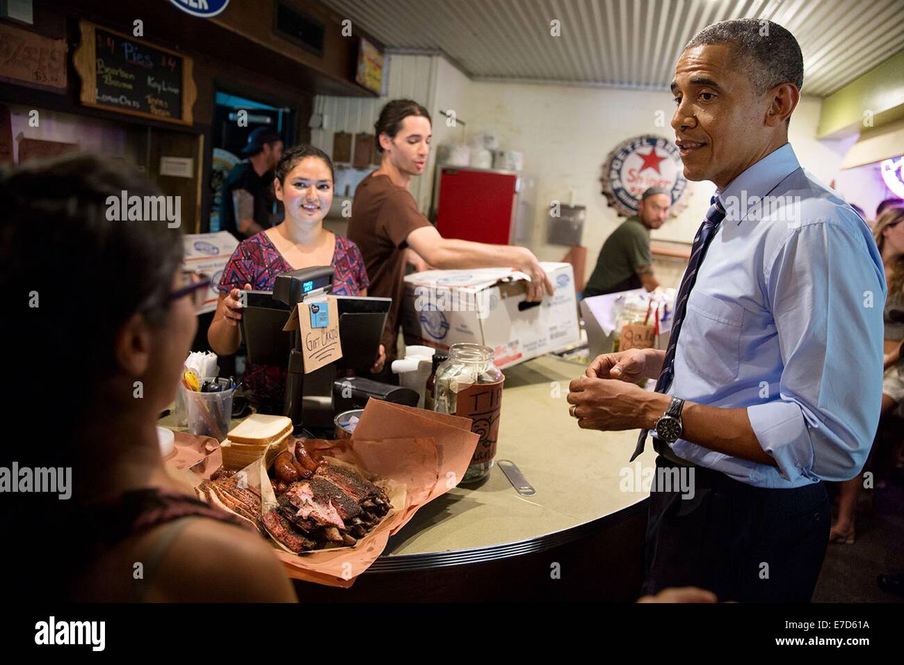 US President Barack Obama orders barbecue for takeout at Franklin Barbecue July 10, 2014 in Austin, Texas Stock Photo
