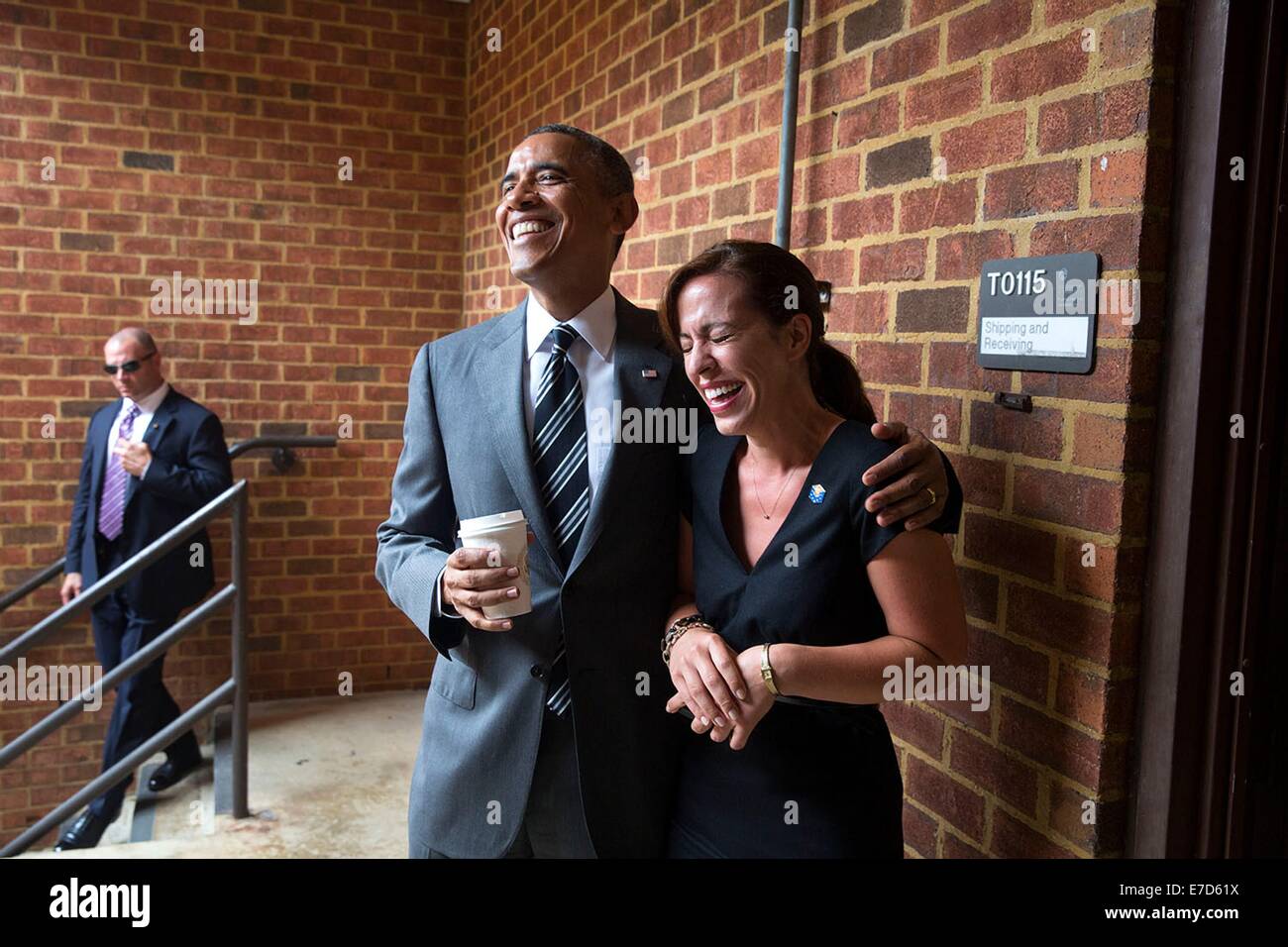 US President Barack Obama greets Casey Breitenbeck, White House Advance Lead, after arriving at the Turner-Fairbank Highway Research Center July 15, 2014 in McLean, Virginia. Stock Photo