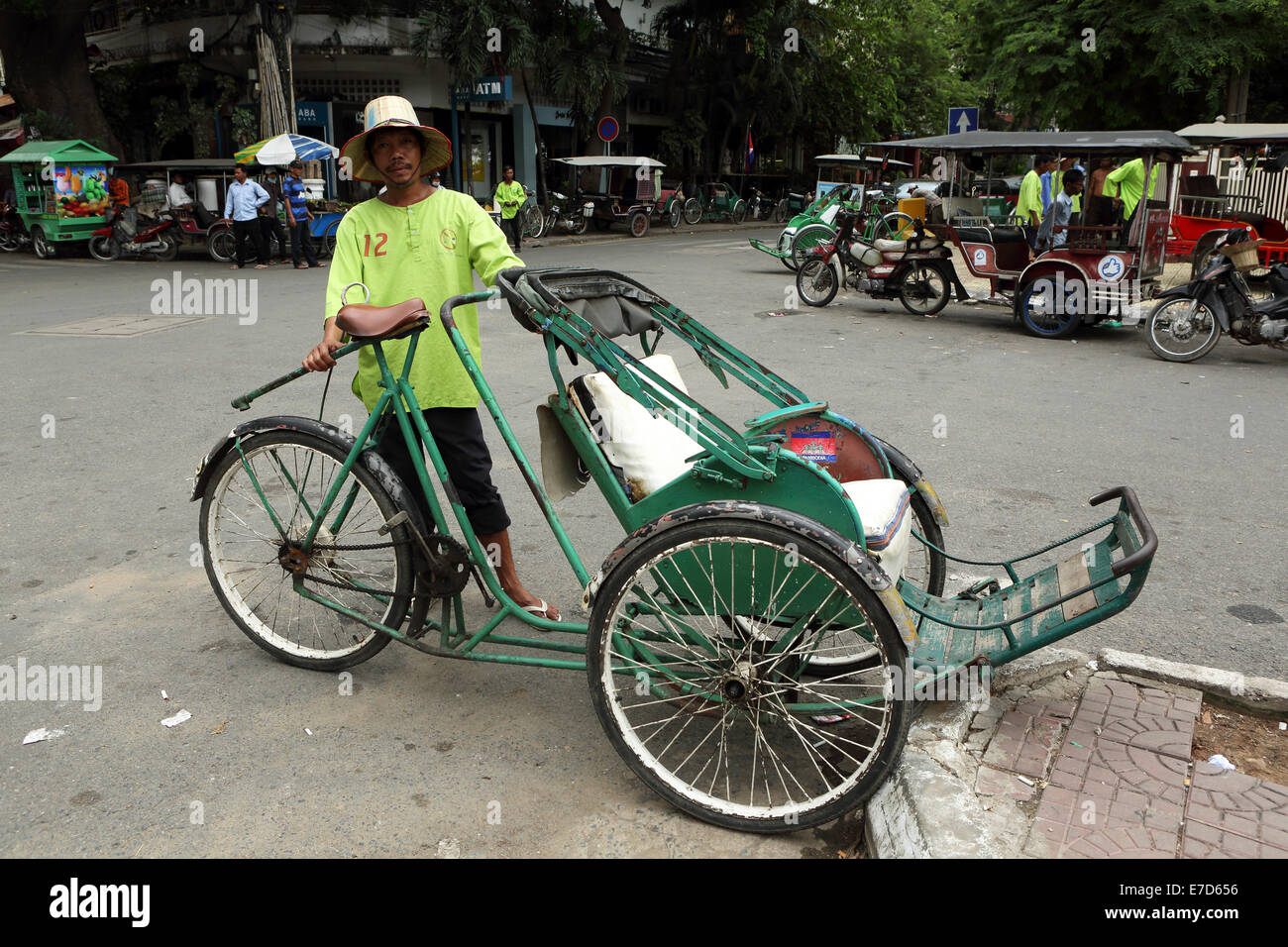 A cyclo rider in Phnom Penh, Cambodia. Stock Photo