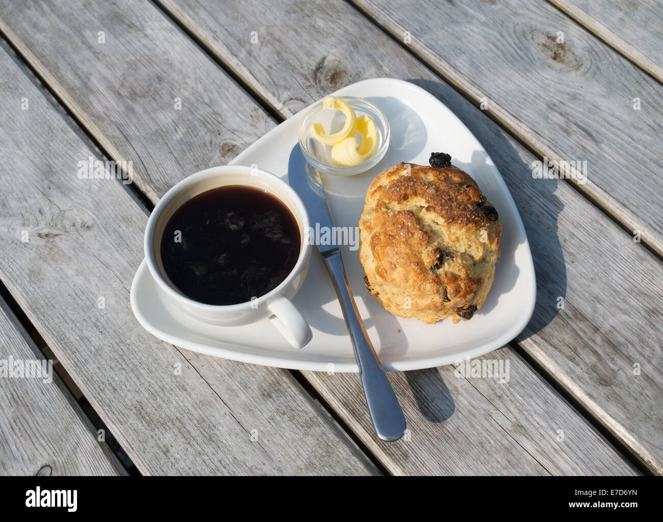 Black coffee, fruit scone scone and butter,  Rydal, Cumbria, England, UK Stock Photo