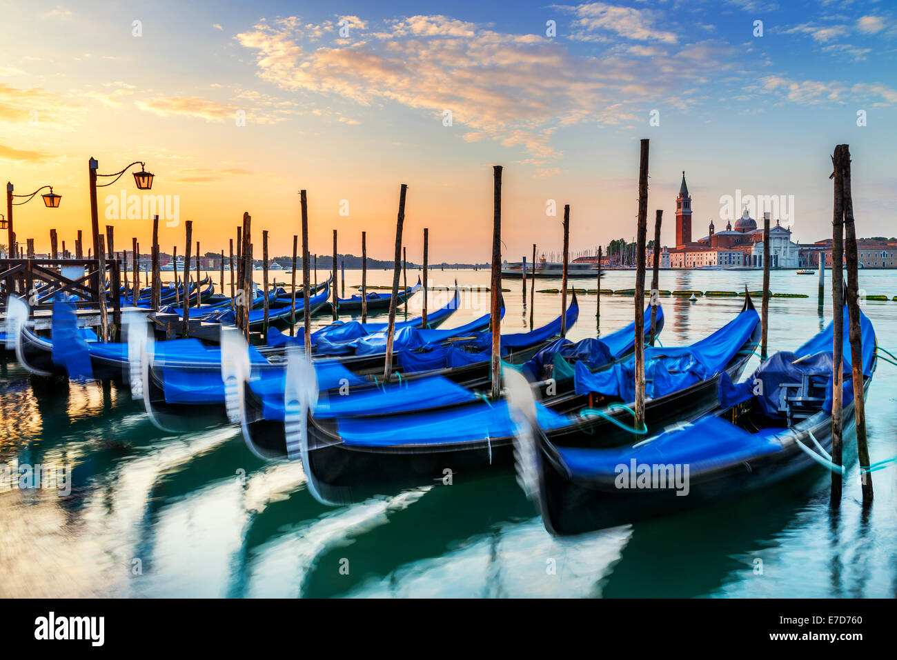 Gondolas moored by Saint Mark square with San Giorgio di Maggiore church in the background - Venice, Venezia, Italy, Europe Stock Photo