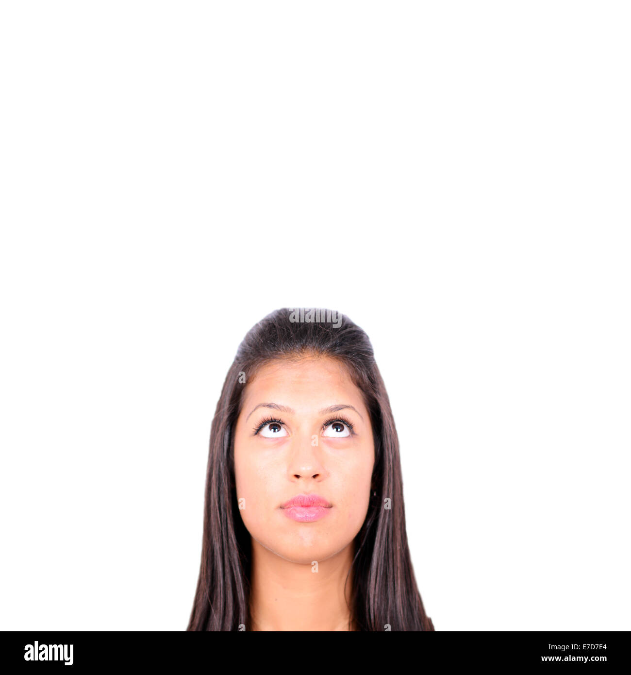 Portrait of young girl with her eyes looking up isolated on white