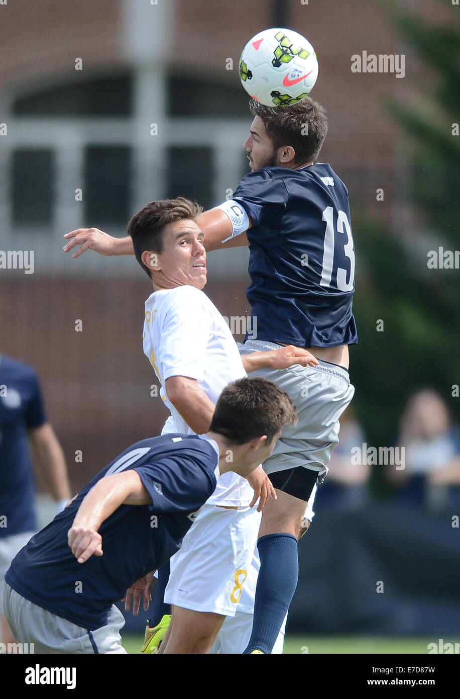 Washington, DC, USA. 14th Sep, 2014. 20140914 - Georgetown midfielder Tyler Rudy (13) heads the ball over UC Irvine midfielder Mats Bjurman (8) and Georgetown forward Alex Muyl (9), lower left, in the first half of an NCAA men's soccer match at Shaw Field in Washington. Georgetown and UCI tied 1-1 in double overtime. © Chuck Myers/ZUMA Wire/Alamy Live News Stock Photo
