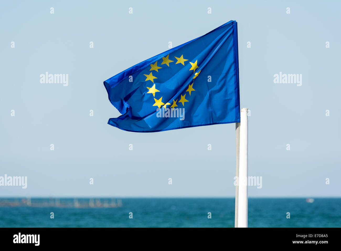 European Union Flag With Blue Sea Background Stock Photo - Alamy