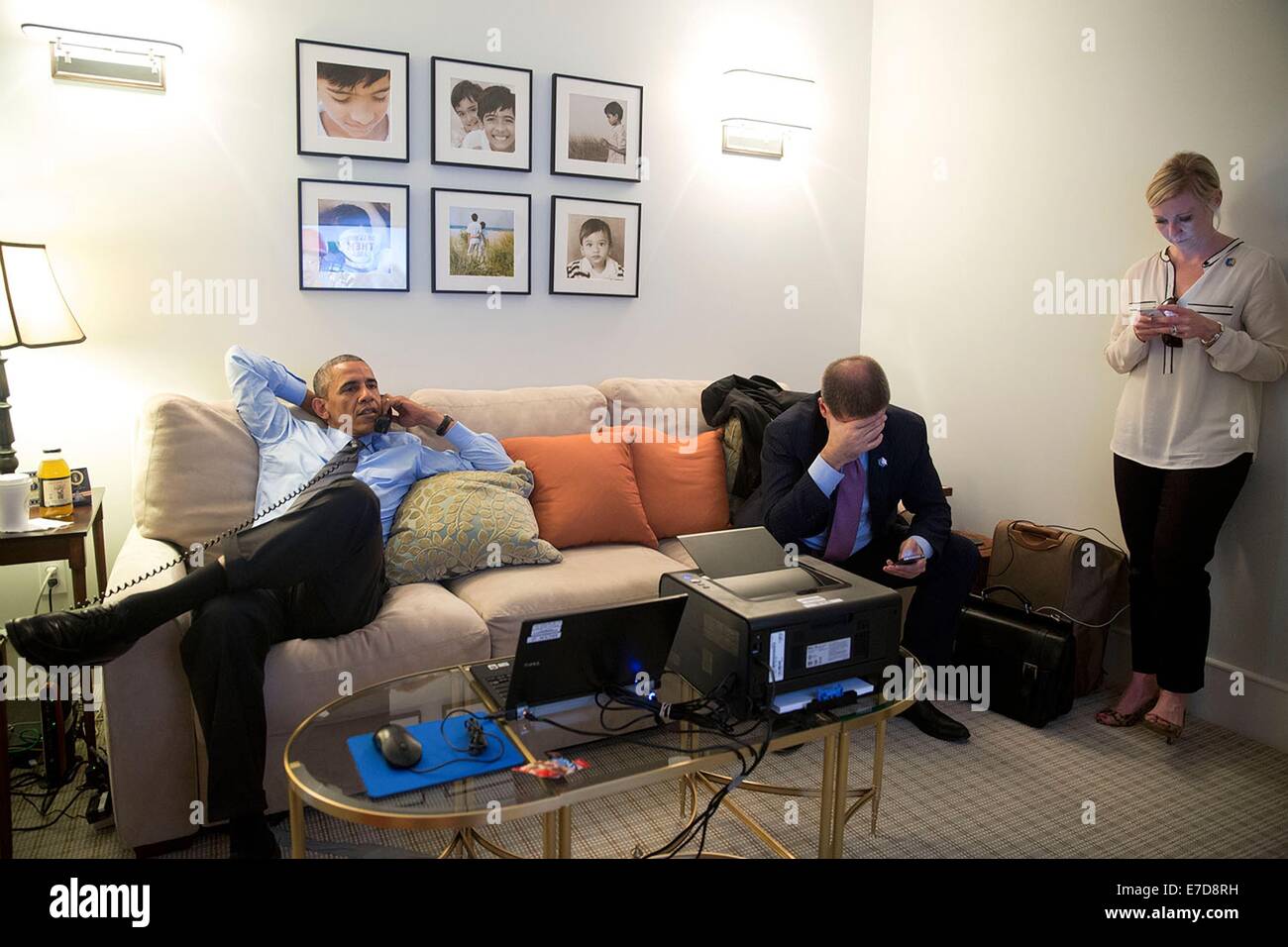 US President Barack Obama holds a conference call regarding the crash of Malaysia Airlines Flight 17 in Ukraine, at a private home July 17, 2014 in New York, N.Y. Senior Advisor Dan Pfeiffer and Anita Breckenridge, Deputy Chief of Staff for Operations attend. Stock Photo