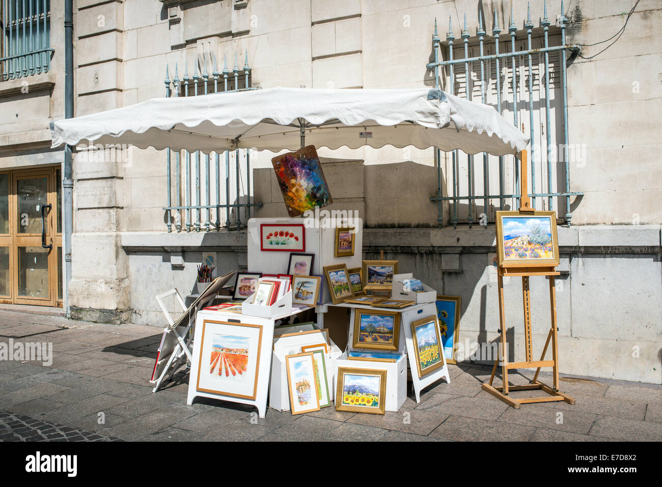 Paintings for sale on a market stall, Avignon, Provence, France. Stock Photo