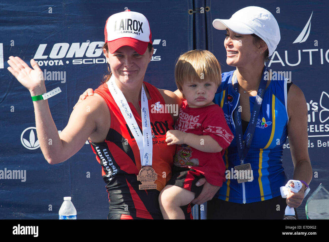 Malibu, California, USA. 14th Sep, 2014. Soap opera actress Heather Tom,  winner of the women's celebrity category, and her son Zane Alexander Achor  stand on the winner podium with second place finisher