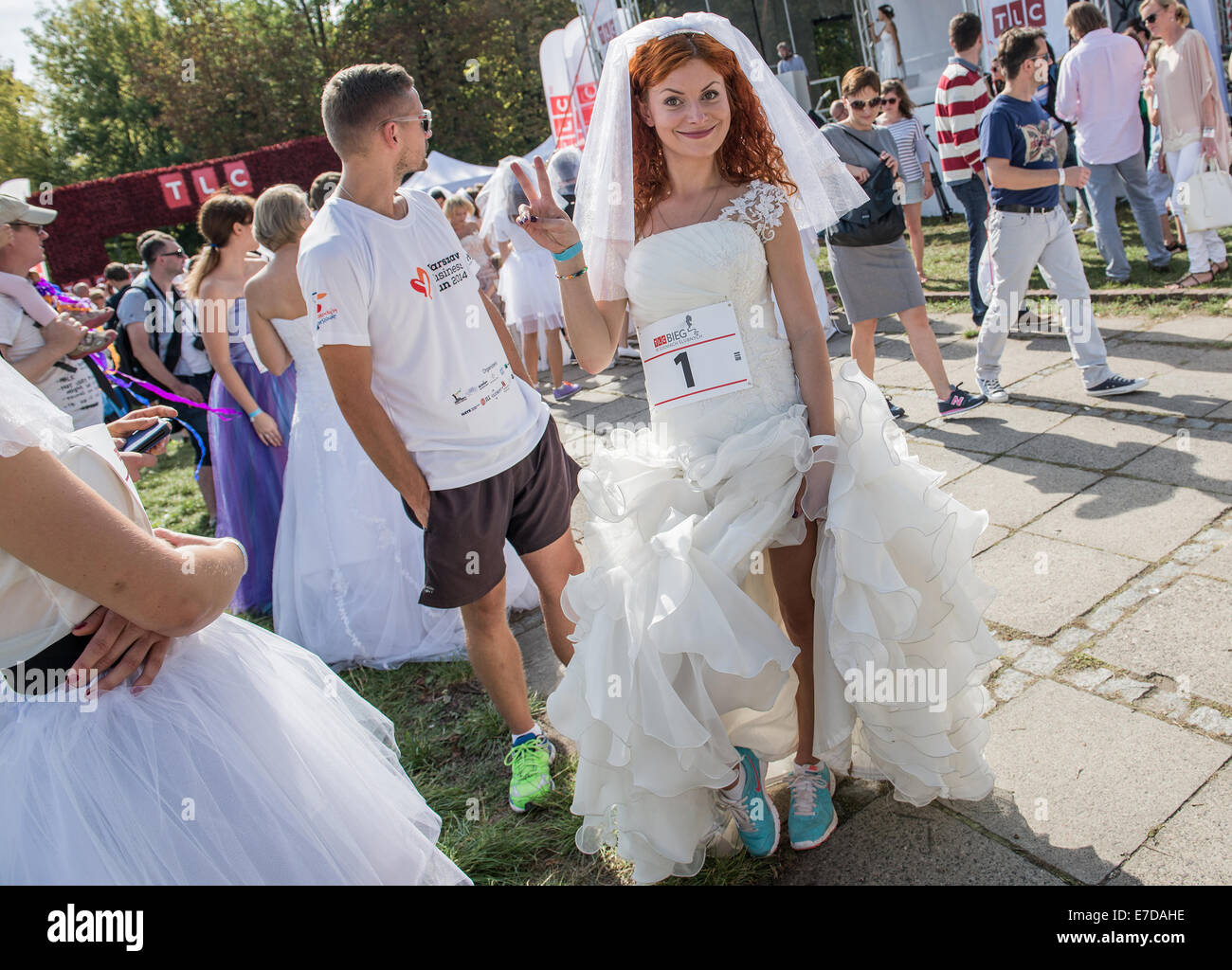 Warsaw, Poland. 15th September, 2014. Participant of the first Polish Wedding Dress Run in Agrykola Park in Warsaw. The collected money from charity run will cover cost of rehabilitation of Julia Torla (Miss Wheelchair 2014 in Poland) who is disabled due to serious back injury after car accident. Credit:  kpzfoto/Alamy Live News Stock Photo
