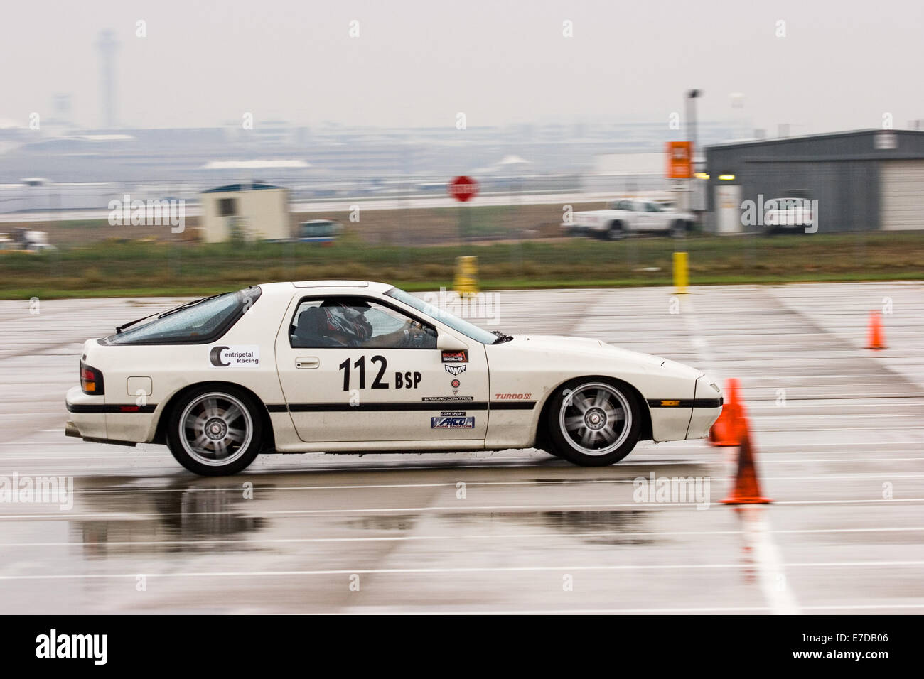 A 1987 White Mazda RX-7 Turbo in an autocross race at a regional Sports Car Club of America (SCCA) event Stock Photo