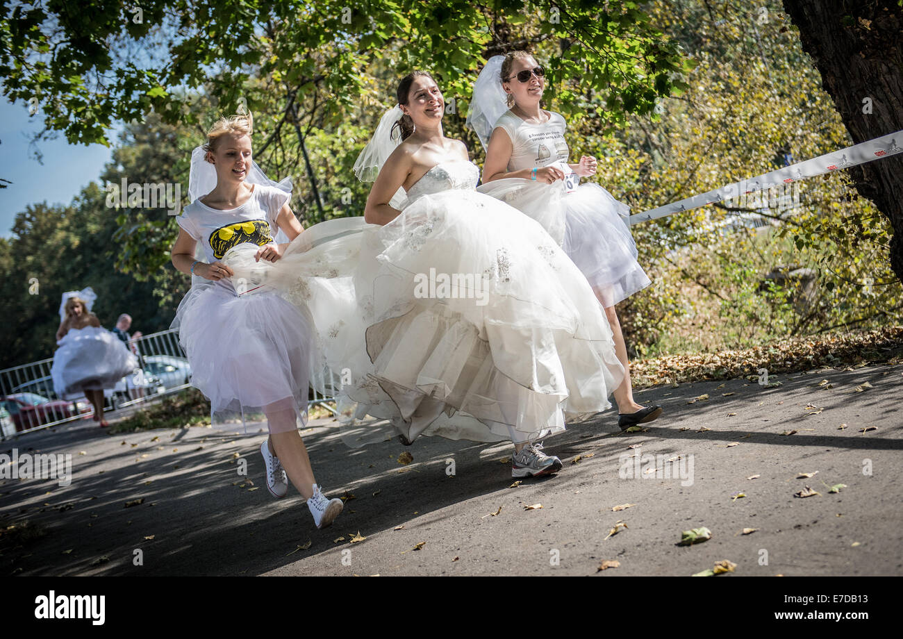 Warsaw, Poland. 15th September, 2014. Participants of the first Polish Wedding Dress Run in Agrykola Park in Warsaw. The collected money from charity run will cover cost of rehabilitation of Julia Torla (Miss Wheelchair 2014 in Poland) who is disabled due to serious back injury after car accident. Credit:  kpzfoto/Alamy Live News Stock Photo