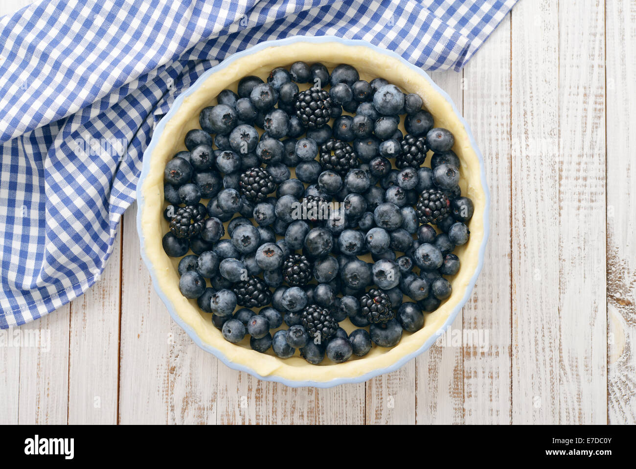 Tasty homemade pie with blueberries and blackberries on wooden table. Top view. Stock Photo