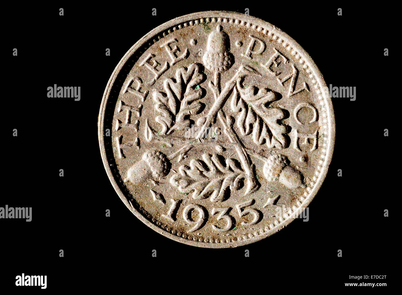 1935 British three pence coin in studio setting Stock Photo