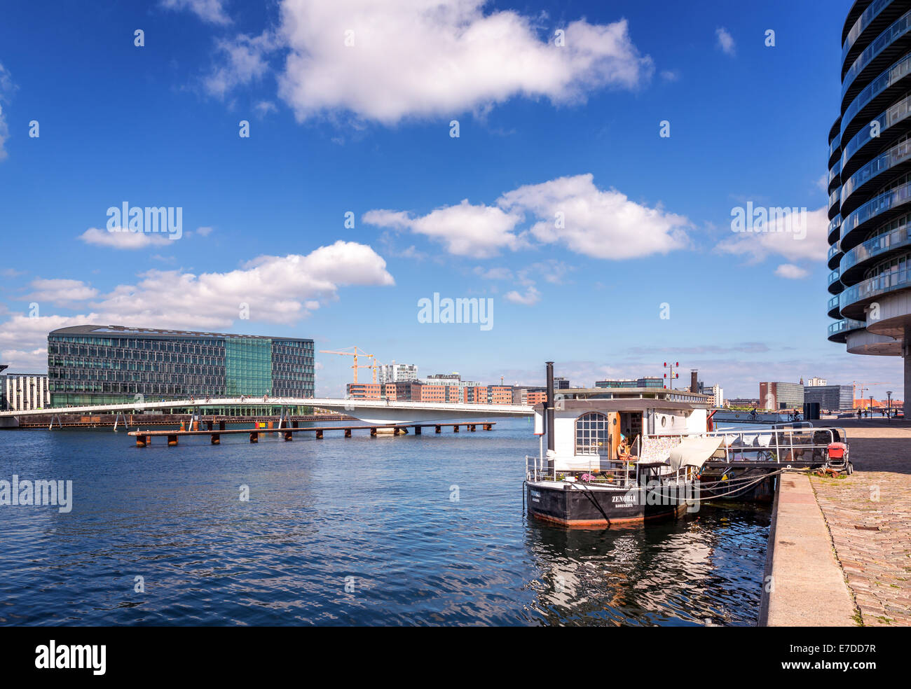 House boat among modern city apartments and office buildings in
