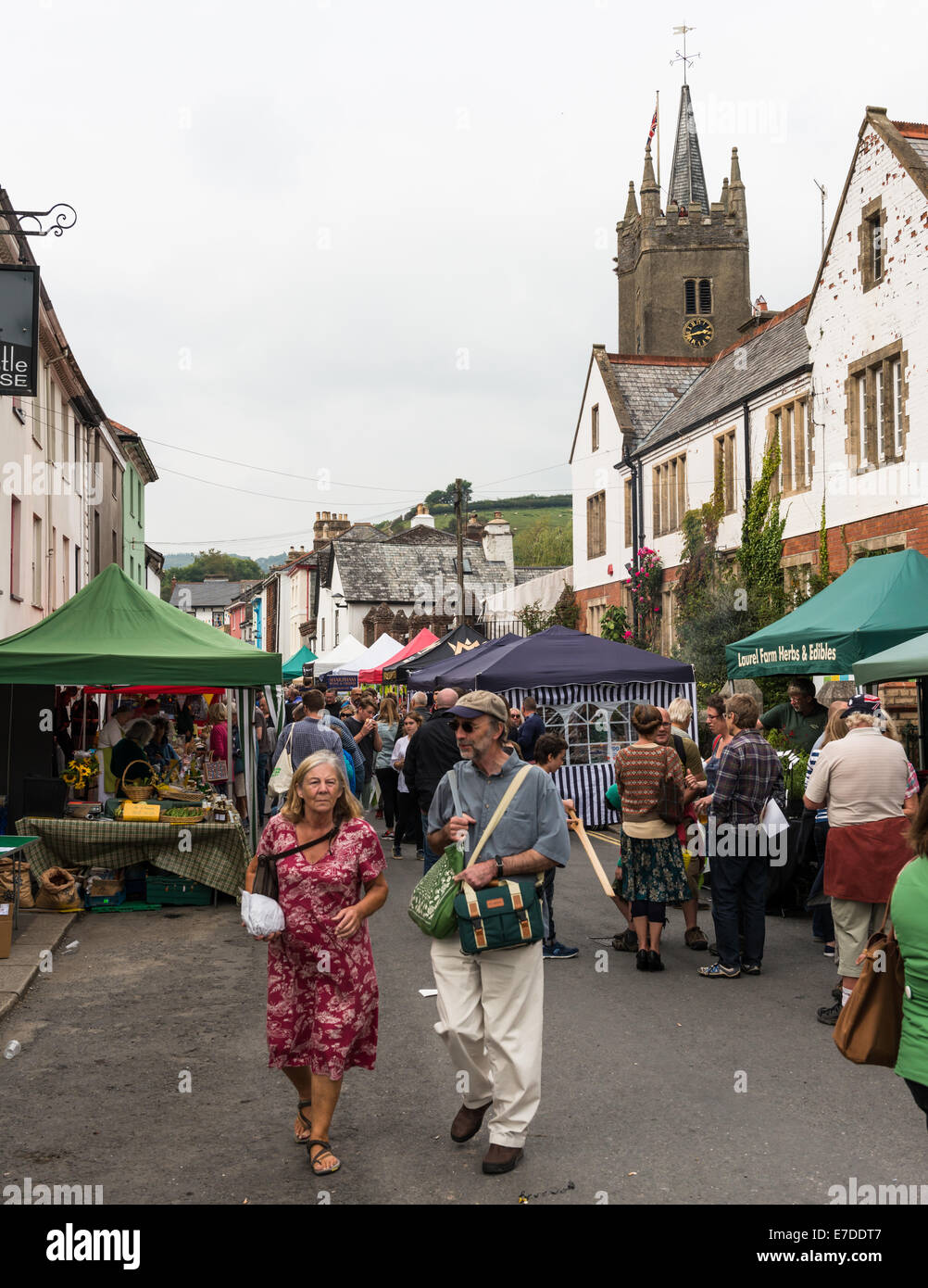 Ashburton Food & Drink Festival view of the street market and stalls with church steeple in the background. Stock Photo