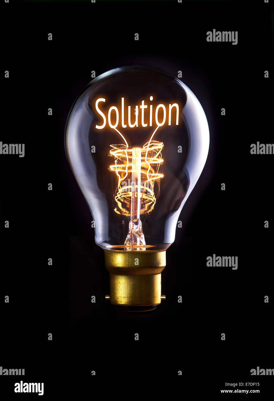Solution concept in a filament lightbulb. Stock Photo
