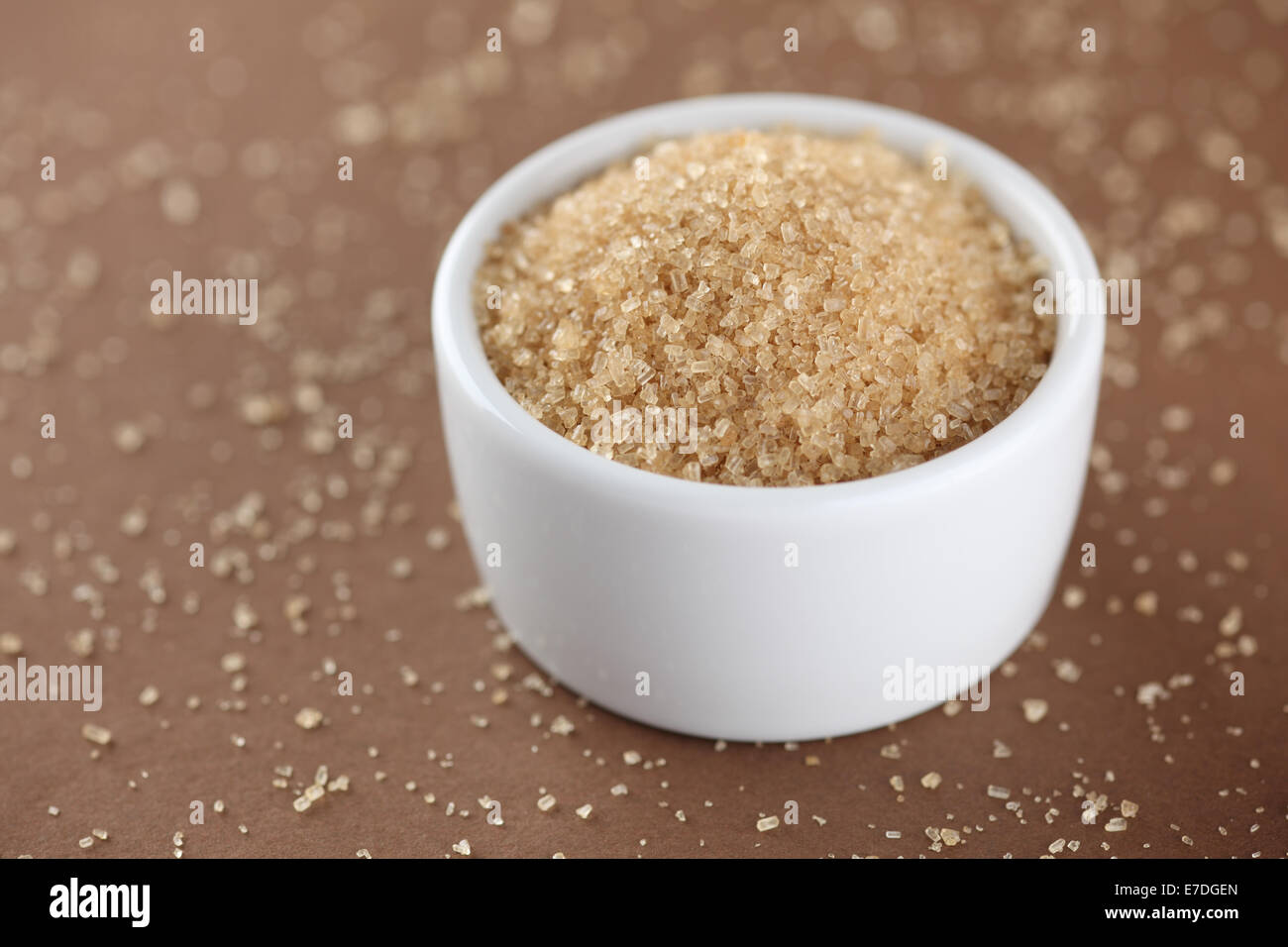 Brown cane sugar in a bowl. Stock Photo