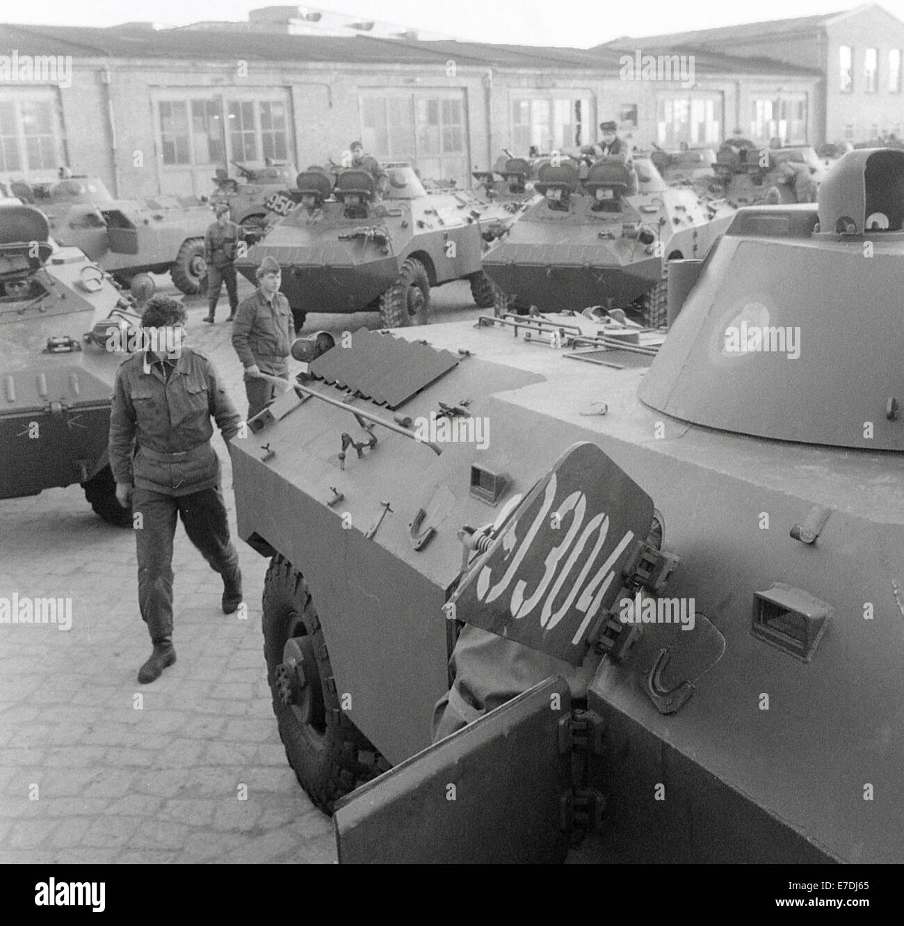 Soldiers of the Border Troops of the German Democratic Republic with armoured personnel carriers, which are earmarked for scrapping, at the maintenance facility Reparaturwerk Neubrandenburg (RWN). The RWN on the grounds of the former torpedo testing facility Torpedoversuchsanstalt Neubrandenburg (TVA) was one of the biggest facilities in Europe for the repair of tanks during the GDR. Photo: Benno Bartocha -NO WIRE SERVICE- Stock Photo