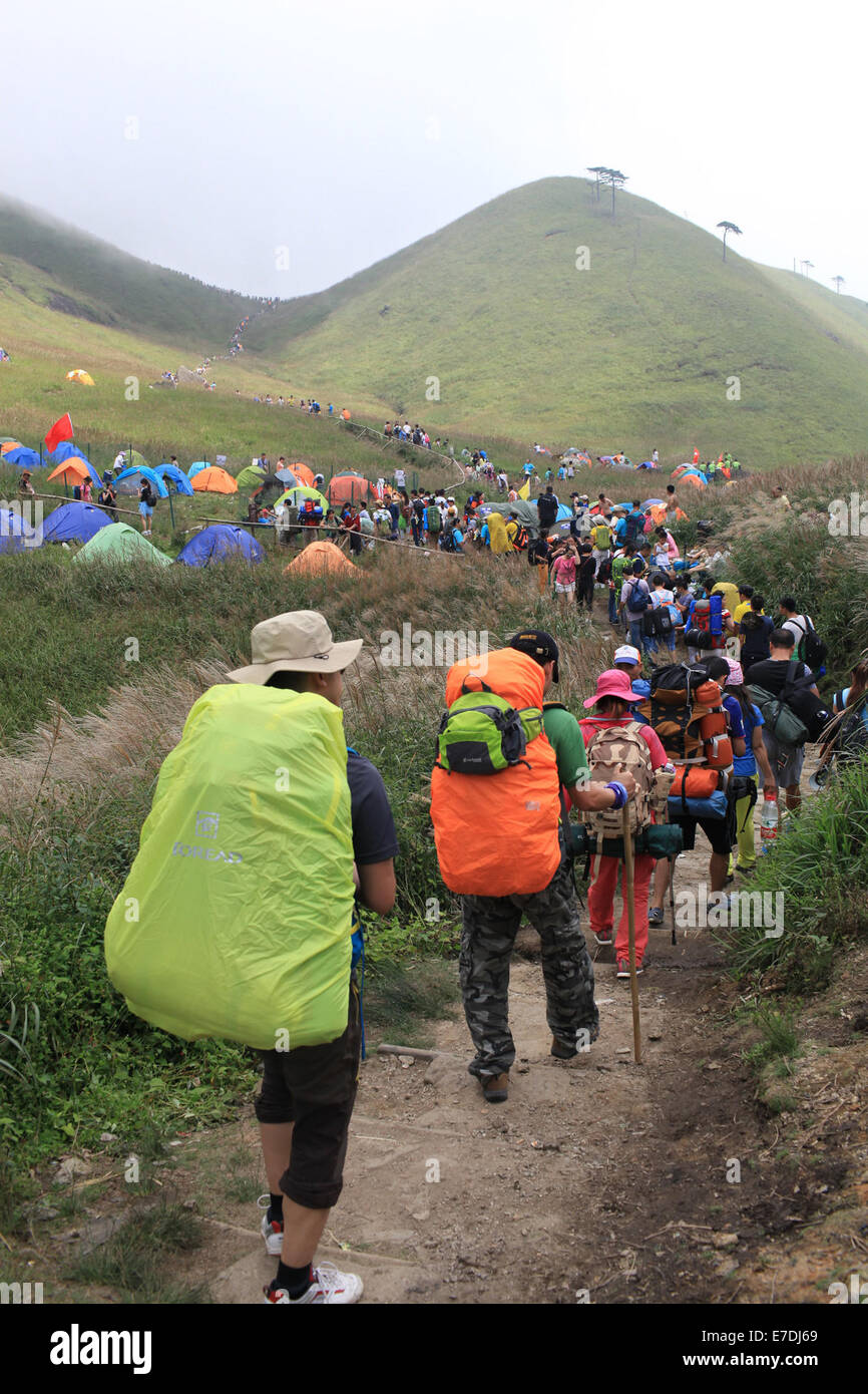 Nanchang, China's Jiangxi Province. 13th Sep, 2014. Travellers go hiking during the 7th Camping Festival of Mountain Wugong in Pingxiang, east China's Jiangxi Province, Sept. 13, 2014. The two-day camping from Sept. 13 to 14 attracted thousands of travellers all around the nation. Credit:  Wen Meiliang/Xinhua/Alamy Live News Stock Photo