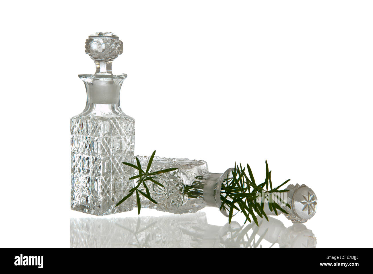 Two sparky glass vinegar bottles with decorative facet structure plugs