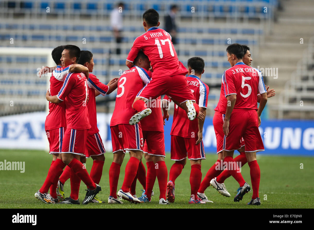 Incheon, South Korea. 15th Sep, 2014. Players of the Democratic People's Republic of Korea (DPRK) celebrate for a goal during the men's football first round group F match against China at the 17th Asian Games in Incheon, South Korea, on Sept. 15, 2014. © Zhang Fan/Xinhua/Alamy Live News Stock Photo