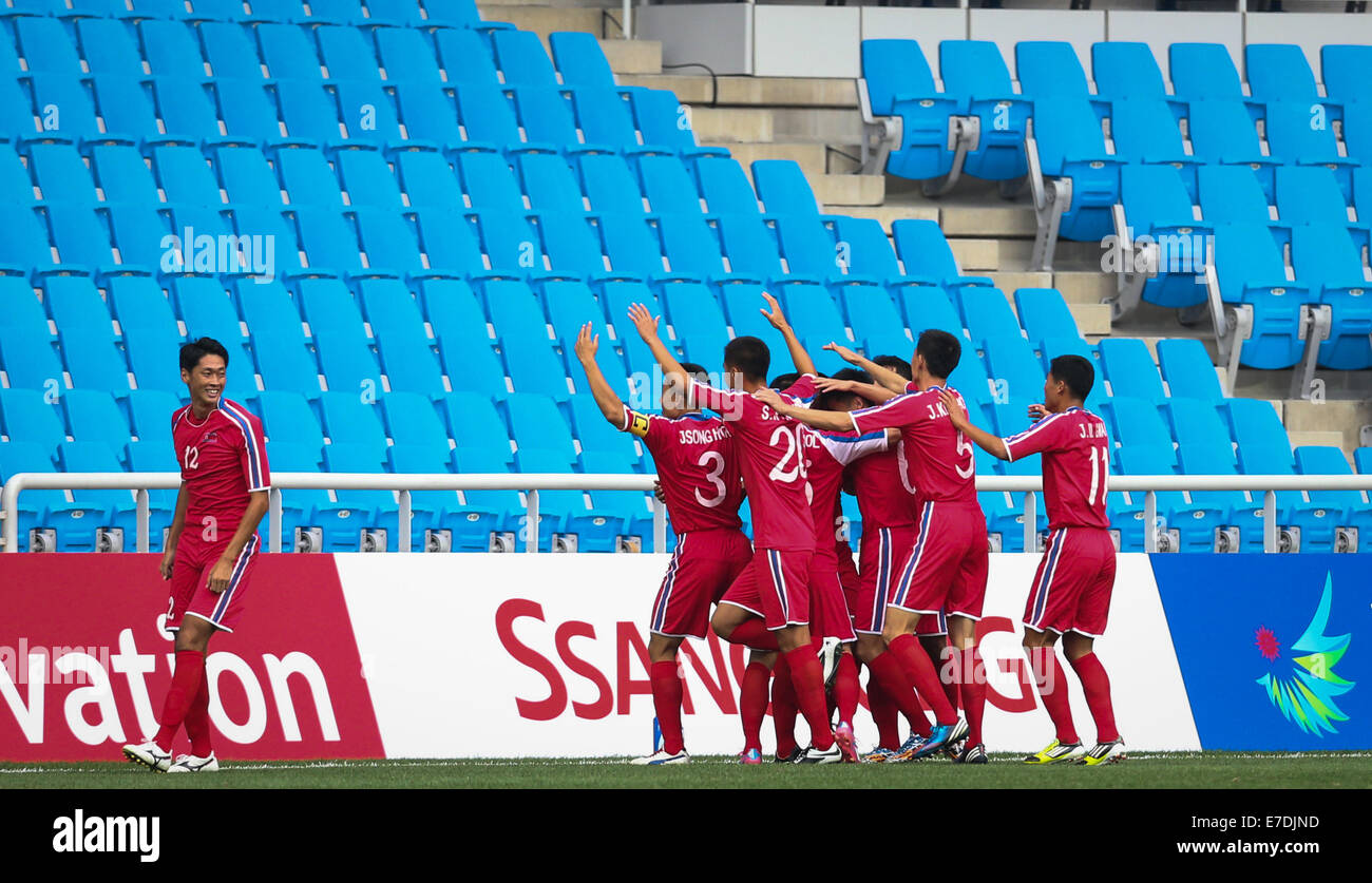 Incheon, South Korea. 15th Sep, 2014. Players of the Democratic People's Republic of Korea (DPRK) celebrate for a goal during the men's football first round group F match against China at the 17th Asian Games in Incheon, South Korea, on Sept. 15, 2014. © Zhang Fan/Xinhua/Alamy Live News Stock Photo