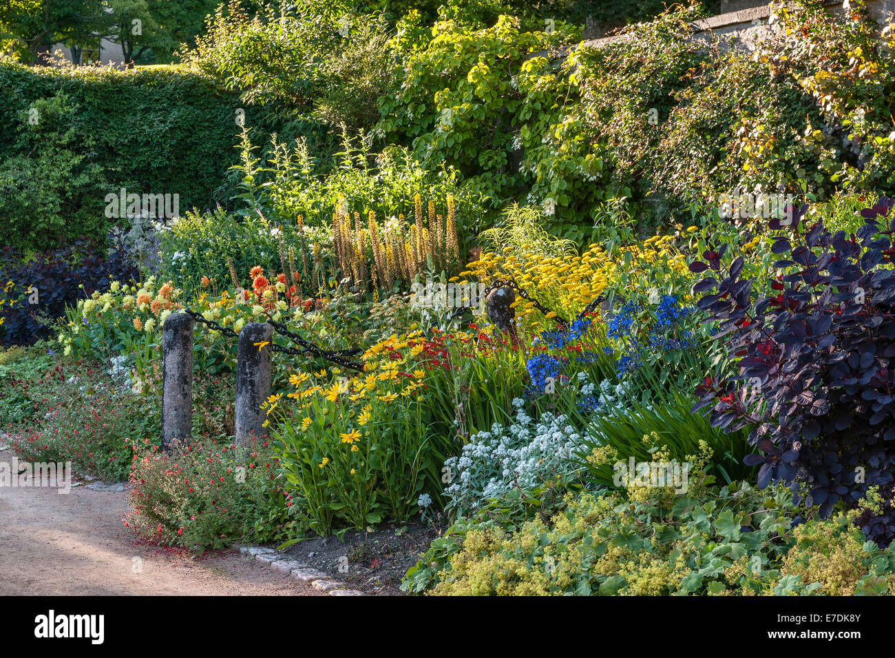 Crathes Castle, Banchory, Scotland, UK. Warm colours in the late summer border in the Upper Pool Garden Stock Photo