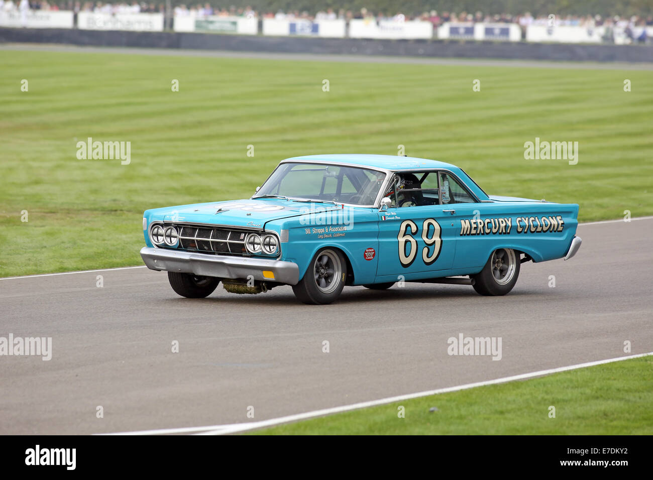 Chichester, West Sussex, UK. 13th Sep, 2014. Pictures from the Goodwood Revival 2014 - The Shelby Cup - A race for saloon cars powered by small-block V8 engines on the 60th anniversary of the small-block V8 engine. A large number of Ford Mustangs mariking the car's 50th anniversary took on other American classics such as Ford Falcon, Plymouth Barracuda, Mercury Comet Cyclone and Dodge Dart. Picture shows: Emanuele Pirro driving a 1964 Mercury Comet Cyclone Credit:  Oliver Dixon/Alamy Live News Stock Photo