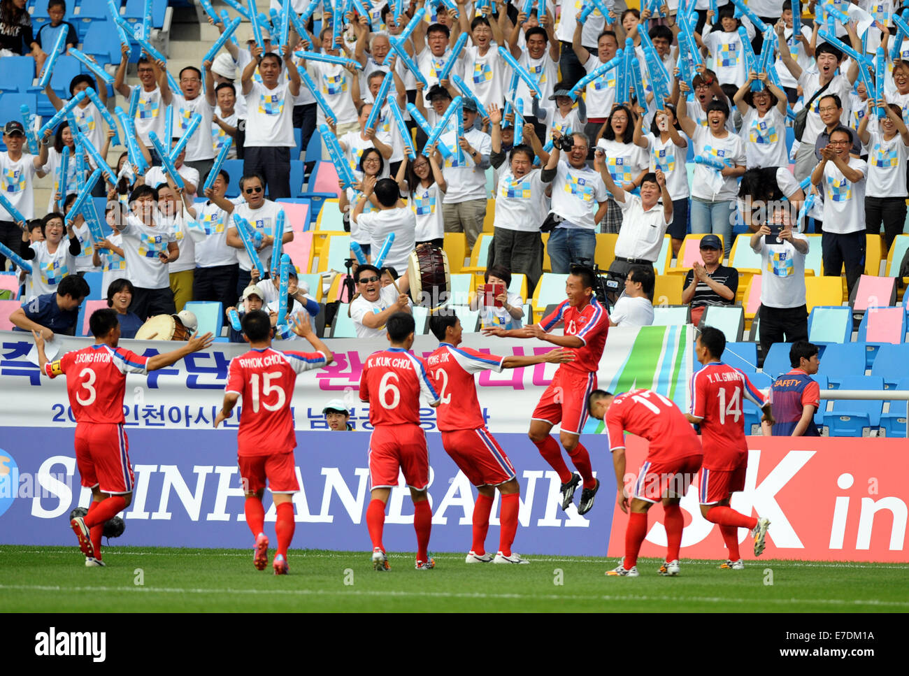 Incheon, South Korea. 15th Sep, 2014. Players of Democratic People's Republic of Korea (DPRK) celebrate for a goal during the men's football first round group F match against China at the 17th Asian Games in Incheon, South Korea, on Sept. 15, 2014. © Lo Ping Fai/Xinhua/Alamy Live News Stock Photo