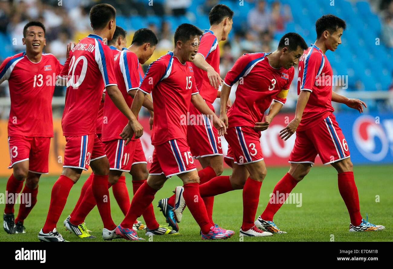 Incheon, South Korea. 15th Sep, 2014. Players of the Democratic People's Republic of Korea (DPRK) celebrate for a goal during their men's football first round group F match against China at the 17th Asian Games in Incheon, South Korea, on Sept. 15, 2014. DPRK won 3-0. © Zhang Fan/Xinhua/Alamy Live News Stock Photo