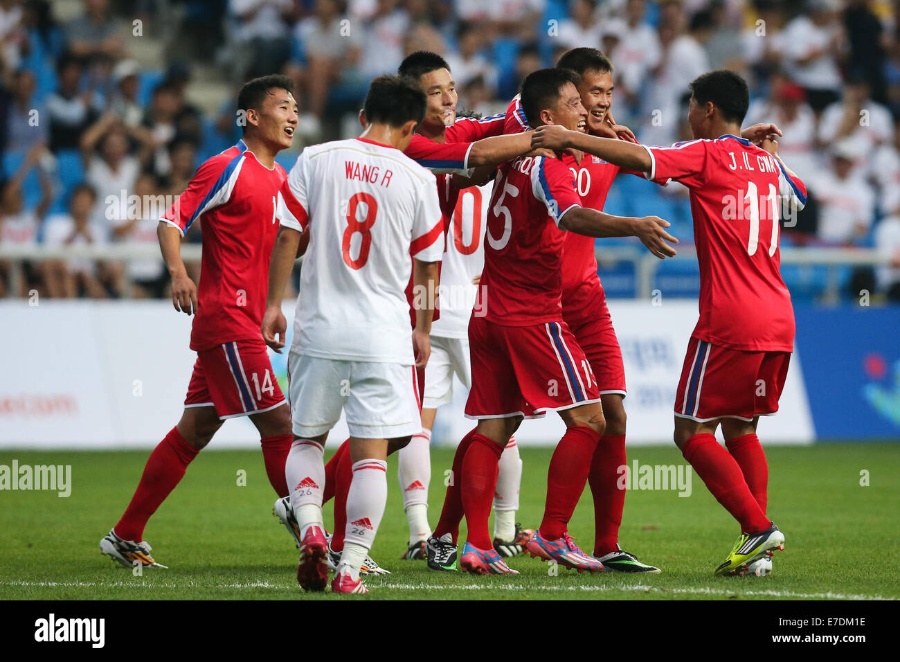 Incheon, South Korea. 15th Sep, 2014. Players of the Democratic People's Republic of Korea (DPRK) celebrate for a goal during the men's football first round group F match against China at the 17th Asian Games in Incheon, South Korea, on Sept. 15, 2014. DPRK won 3-0. © Zhang Fan/Xinhua/Alamy Live News Stock Photo