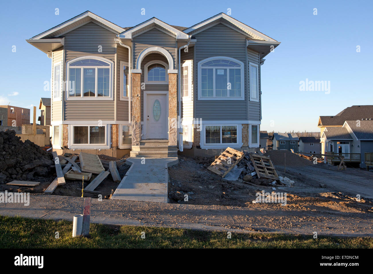 Construction of traditional style house in new neighbourhood, Fort