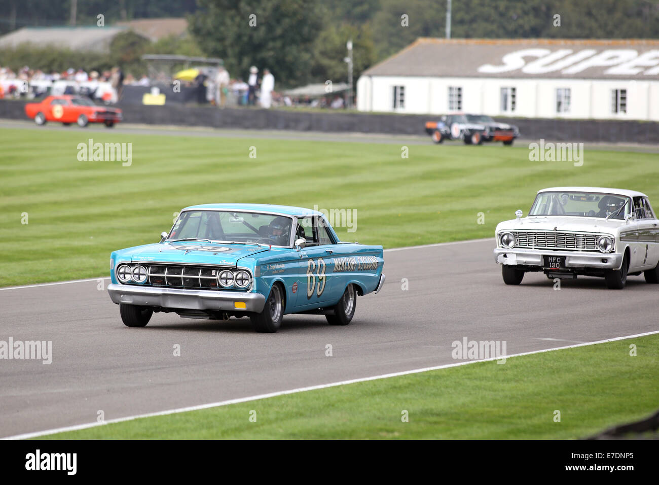 Chichester, West Sussex, UK. 13th Sep, 2014. Pictures from the Goodwood Revival 2014 - The Shelby Cup - A race for saloon cars powered by small-block V8 engines on the 60th anniversary of the small-block V8 engine. A large number of Ford Mustangs mariking the car's 50th anniversary took on other American classics such as Ford Falcon, Plymouth Barracuda, Mercury Comet Cyclone and Dodge Dart. Picture shows: Roger Wills driving a 1964 Mercury Comet Cyclone Credit:  Oliver Dixon/Alamy Live News Stock Photo