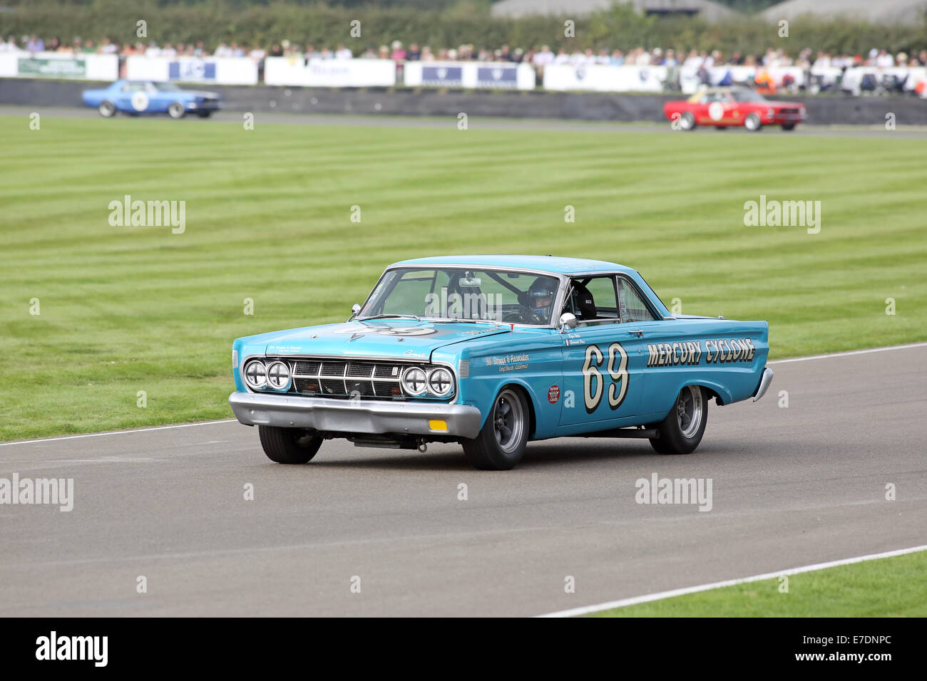 Chichester, West Sussex, UK. 13th Sep, 2014. Pictures from the Goodwood Revival 2014 - The Shelby Cup - A race for saloon cars powered by small-block V8 engines on the 60th anniversary of the small-block V8 engine. A large number of Ford Mustangs mariking the car's 50th anniversary took on other American classics such as Ford Falcon, Plymouth Barracuda, Mercury Comet Cyclone and Dodge Dart. Picture shows: Roger Wills driving a 1964 Mercury Comet Cyclone Credit:  Oliver Dixon/Alamy Live News Stock Photo