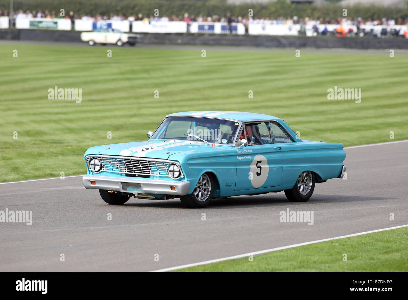 Chichester, West Sussex, UK. 13th Sep, 2014. Pictures from the Goodwood Revival 2014 - The Shelby Cup - A race for saloon cars powered by small-block V8 engines on the 60th anniversary of the small-block V8 engine. A large number of Ford Mustangs mariking the car's 50th anniversary took on other American classics such as Ford Falcon, Plymouth Barracuda, Mercury Comet Cyclone and Dodge Dart. Picture shows: Rowan Atkinson (Mr Bean) driving a 1964 Ford Falcon Spirit Credit:  Oliver Dixon/Alamy Live News Stock Photo