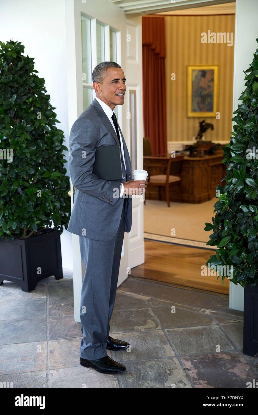 US President Barack Obama stands on the Colonnade outside the Oval Office upon arrival from the Department of Housing and Urban Development July 31, 2014 in Washington, DC. Stock Photo