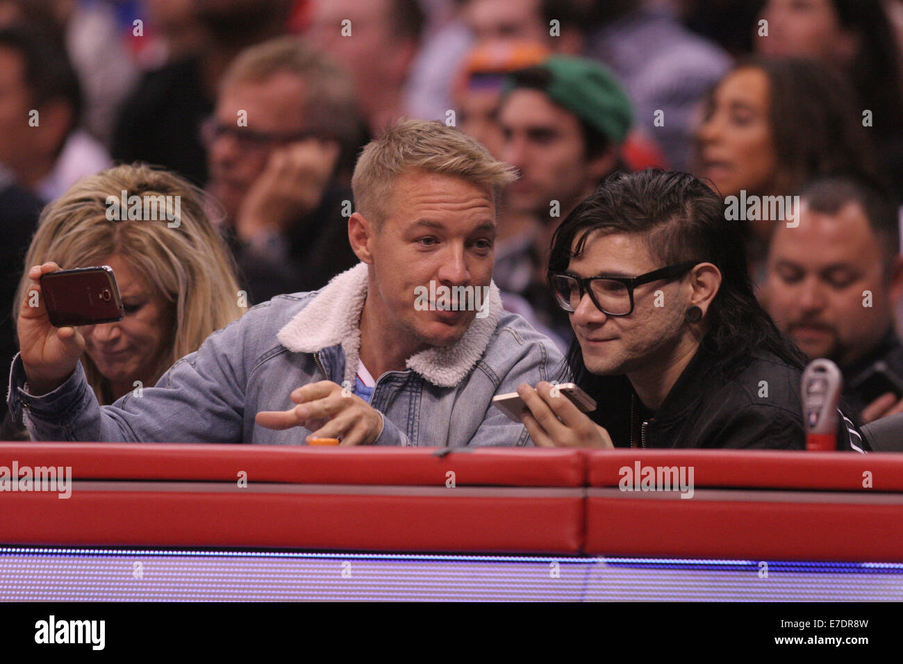 Celebrities out at the Los Angeles Clippers game who defeated the Phoenix Suns by the final score of 112-105 at Staples Center  Featuring: Diplo,Skrillex Where: Los Angeles, California, United States When: 10 Mar 2014 Stock Photo