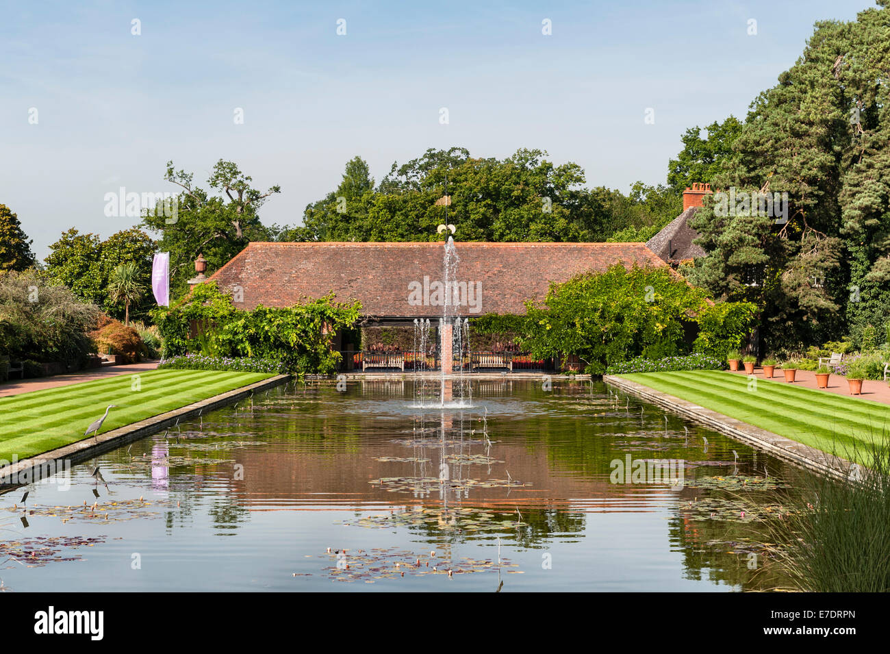 The Royal Horticultural Society (RHS) gardens, Wisley, Surrey, UK. View down the canal towards the loggia Stock Photo