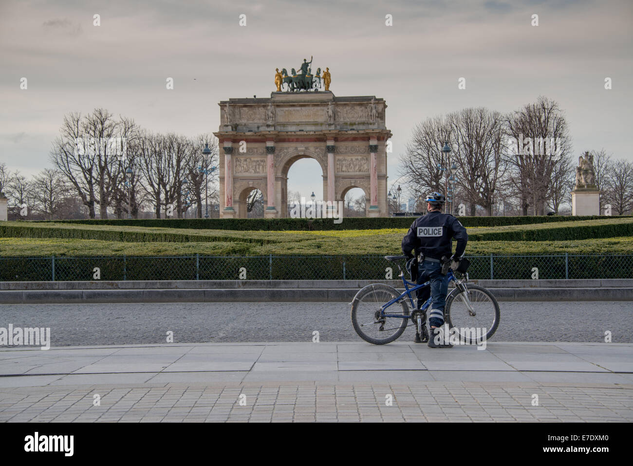 Paris policeman on bicycle outside the Louvre Stock Photo
