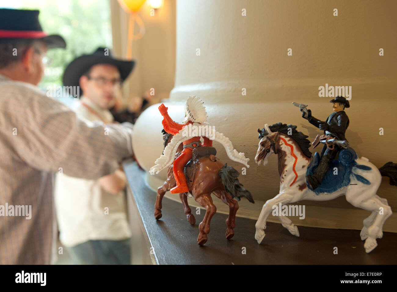 Plastic models of cowboy and native indian on horseback in bar, Calgary, Alberta, Canada Stock Photo