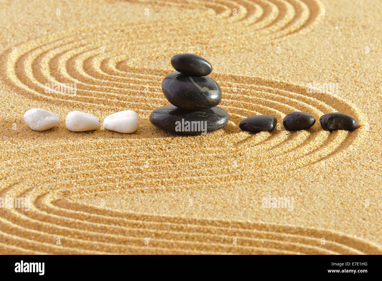 Japanese garden with rocks in sand and yin and yang Stock Photo