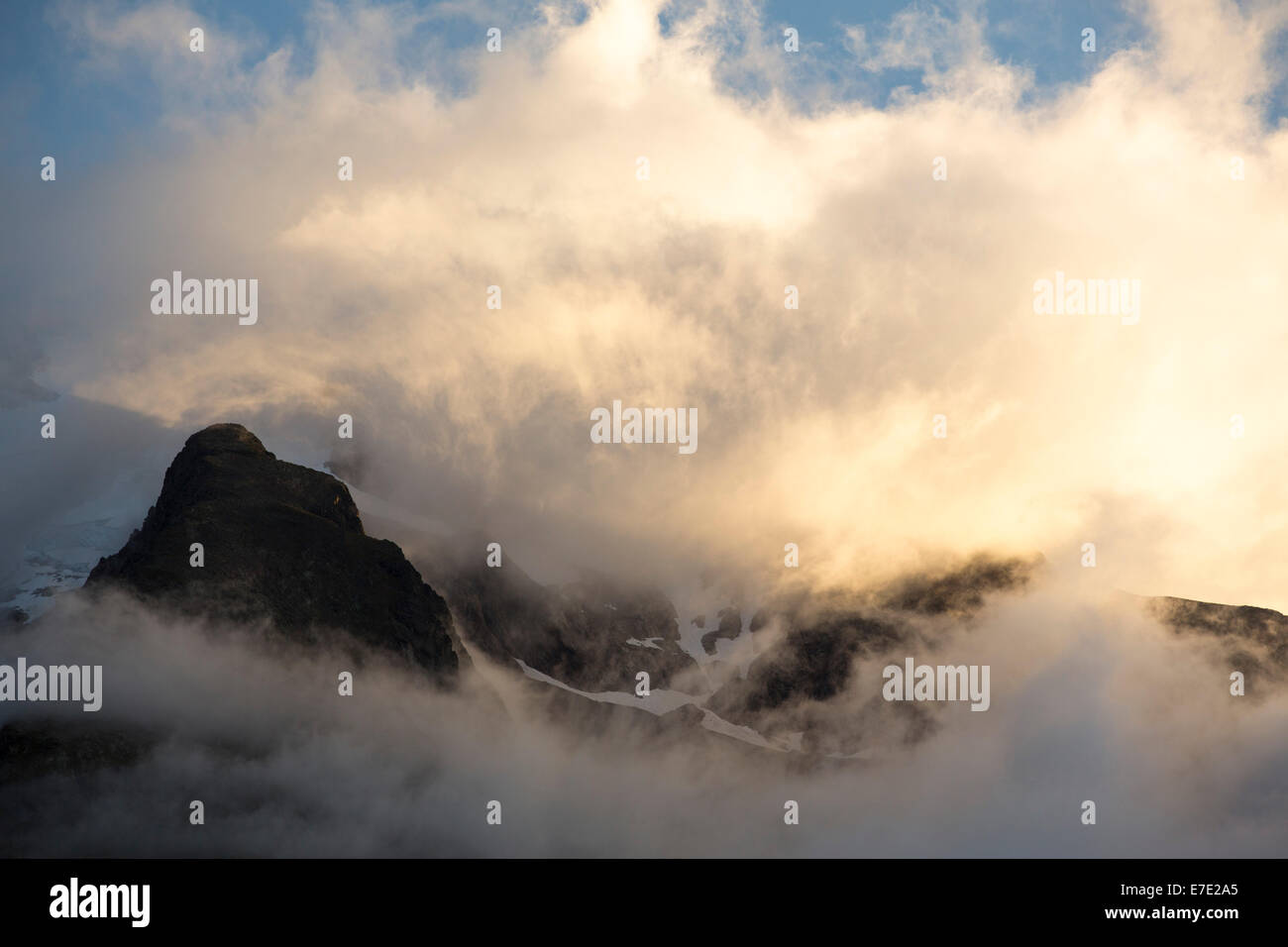 Mists swirling around Mont Tondu, part of the Mont Blanc range, at dawn. Stock Photo