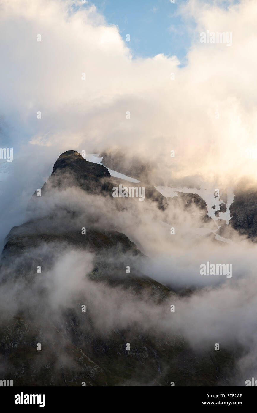Mists swirling around Mont Tondu, part of the Mont Blanc range, at dawn. Stock Photo